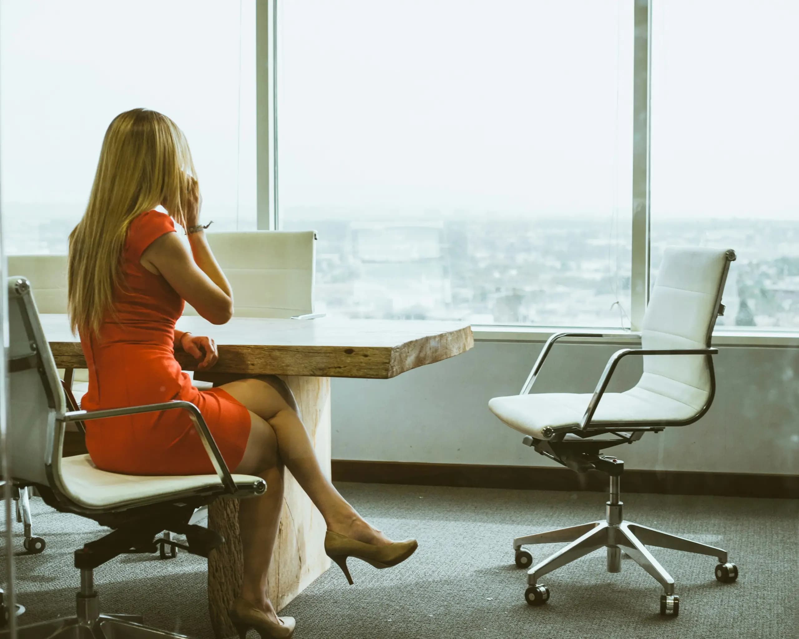 Internal mobility represented by a corporate woman in an office.