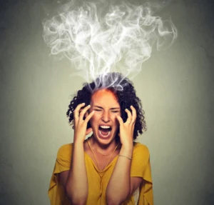 A very frustrated woman screaming with steam smoke coming out the top of her head.