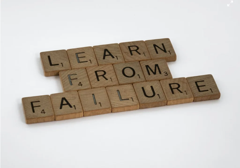 Game pieces that spell the words Learn from failure.