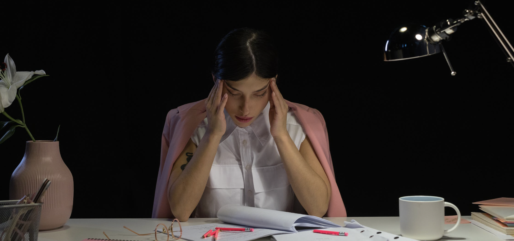 Tired and disengaged worker at a desk.