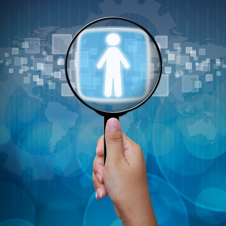 Mentoring Is More than the Match 6 A hand holding a magnifying glass, choosing the right person to be a mentor.