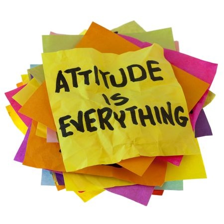 Attitude is Everything written on a stack of colorful reminder notes.