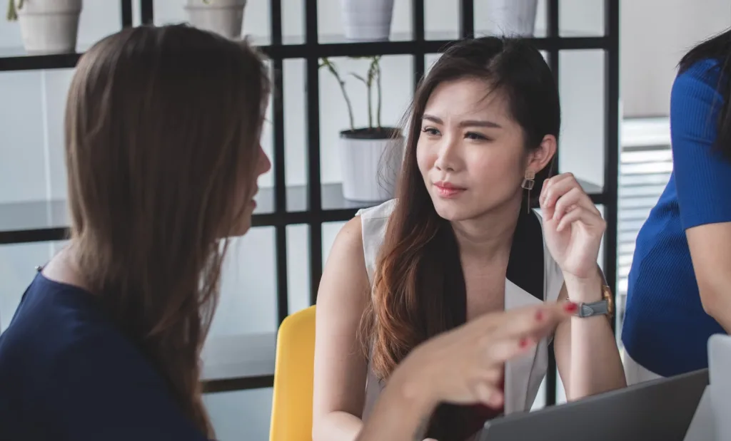 Woman being a good mentor while listening to her mentee.