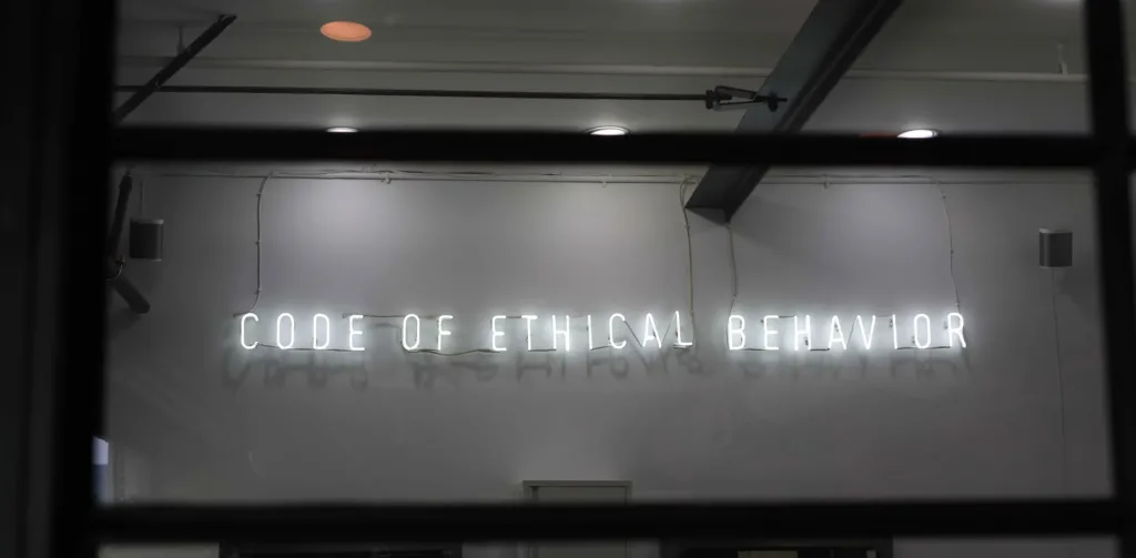 Image of a sign that reads, code of ethical behavior.