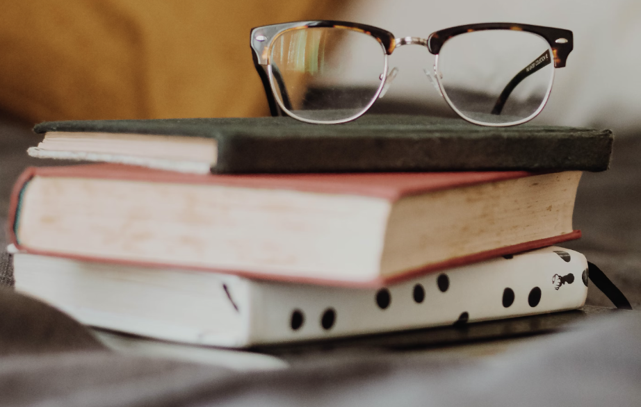 Stack of books on mentoring